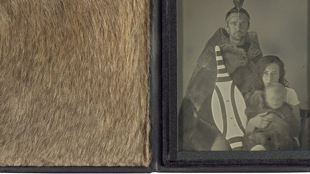 James, Rebecca and Sam Mapu, 2021 (detail). James Tylor, Craig Tuffin, Dr Elisa deCourcy A leather case displaying Grey Kangaroo fur beside a greyscale photograph of a family.