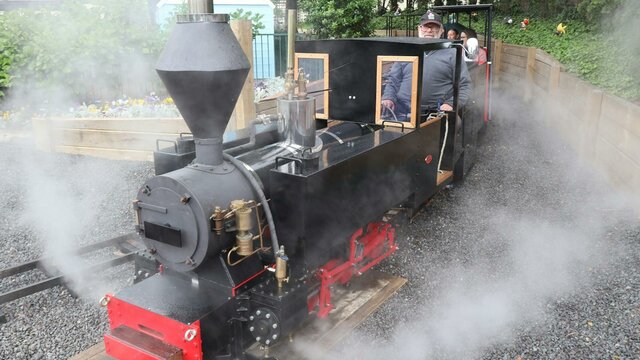Miniature Steam Train Steam is coming out of the miniature steam train