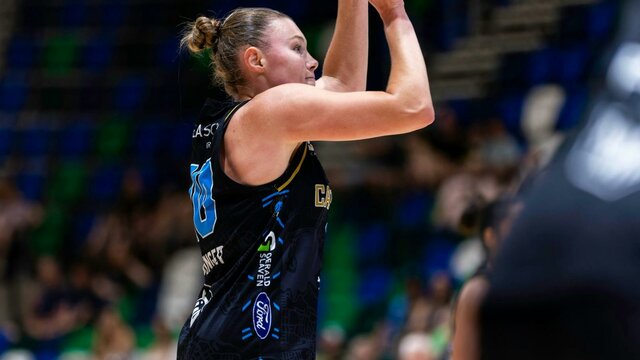 UC Capitals player shooting the basketball.