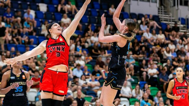 UC Capitals player shooting the basketball while a defender closes in.