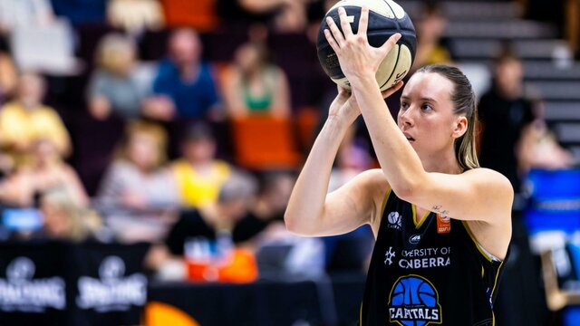 UC Capitals player shooting the basketball.