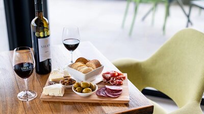 grazing platter and red wine on a table from Shaw Estate Wines Canberra