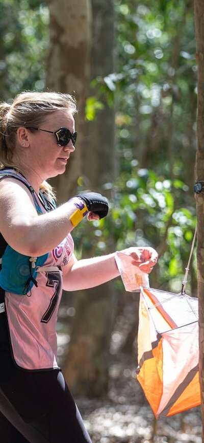 a participant 'registering' at the checkpoint at the Women Only Adventure Race