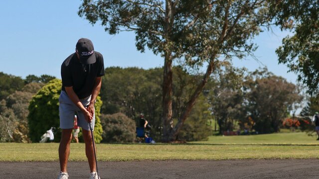 Putting on Sand Greens Male golfer making a putt on sand greens