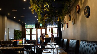 Line of tables in empty restaurant