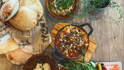 Spread of Lebanese food on wooden table