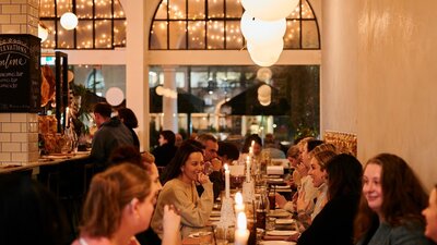 Group of people eating in Italian restaurant