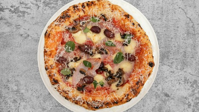 Capricosa San Marzano Tomatoes, Fior de latte, Double smoke ham, Mushrooms and Olives finish with Oregano