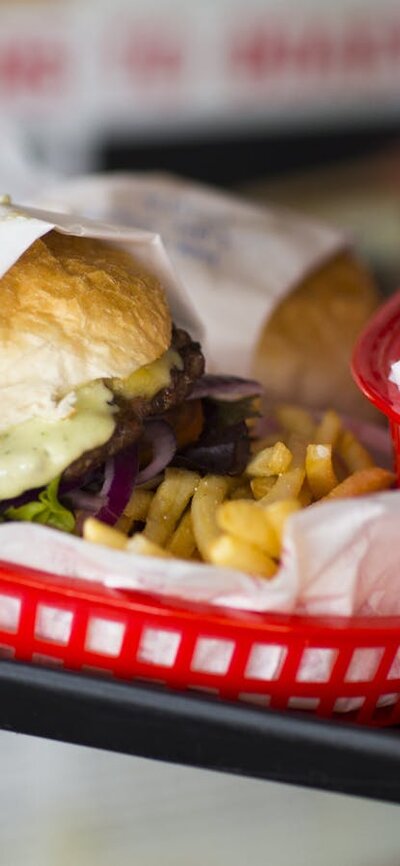 Ready to eat Plates of burgers and fries on a tray