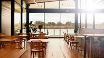 An image of Cafe Sosta's interior; with a view out onto Lake Burley Griffin