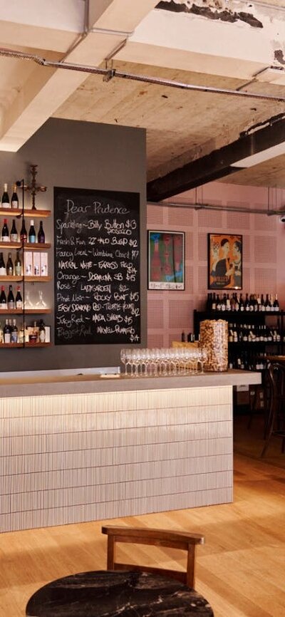 Bar with shelf full of different wines