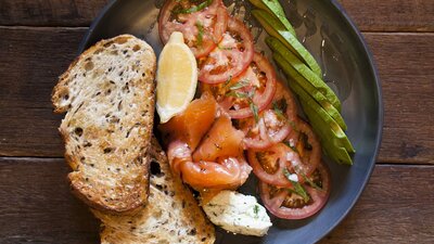 Plate of salmon, vegetables with toast