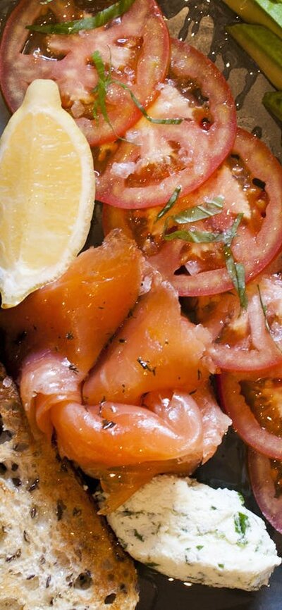 Plate of salmon, vegetables with toast