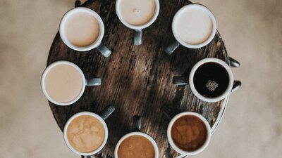 Circle of different coloured coffees