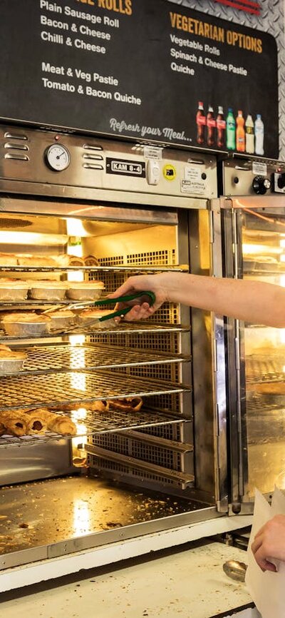 Waitress serves pies at the bakery