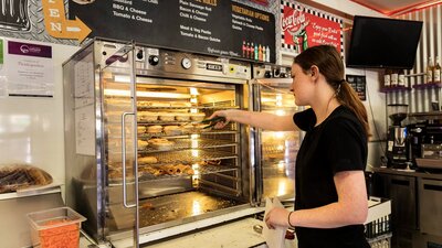 Waitress serves pies at the bakery