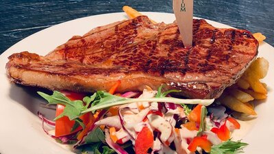 Steak on a plate with salad