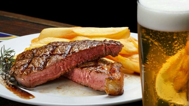 Steak with fries and beer