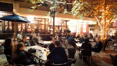 Beer garden full of patrons at night