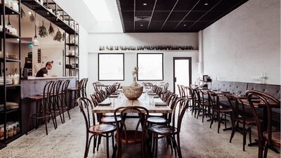 Empty restaurant with tables set ready for service