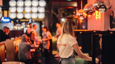 Restaurant interior at night filled with diners