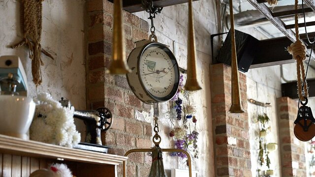 Exposed brick, lake views and great food Quirky hanging objects from wooden beams and exposed brick walls