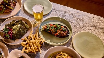 A selection of Mediterranean dishes on a table in a restaurant.