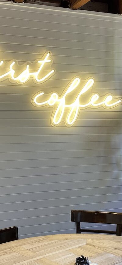 Sign which says ' But first coffee', inside Merino Cafe, Gunning,