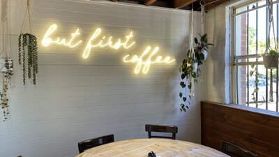 Sign which says ' But first coffee', inside Merino Cafe, Gunning,