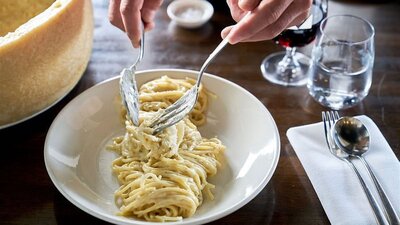 Plate of spaghetti on restaurant table