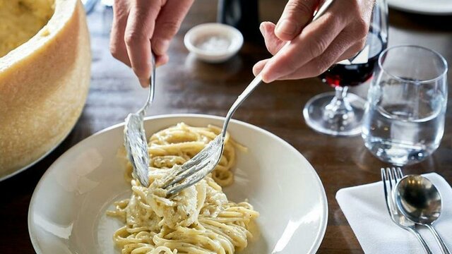 Plate of spaghetti on restaurant table