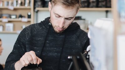 Barista making coffee