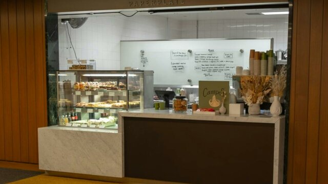 The front of Paperplate cafe at the National Library of Australia. The front of a cafe register.