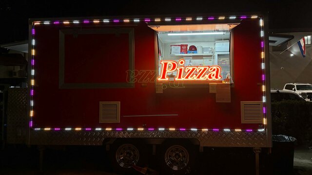 Pizza trailer at night outside of Australian Croatian club in Turner
