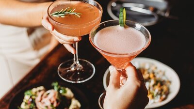 Cocktail drinks being clinked