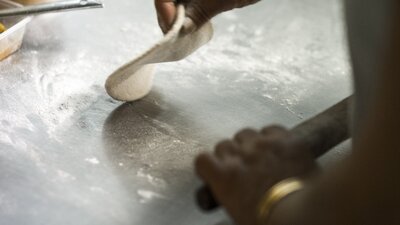 Chef rolling out dough
