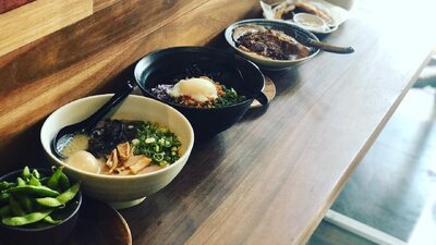 Bowls of ramen on long table