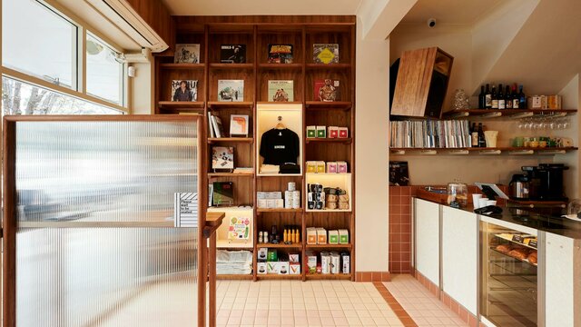 Retail display and front counter this photo shows a retail display of coffee and books, a front counter of a cafe and some vinyl