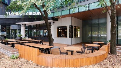 Outdoor cafe setting with wooden furniture