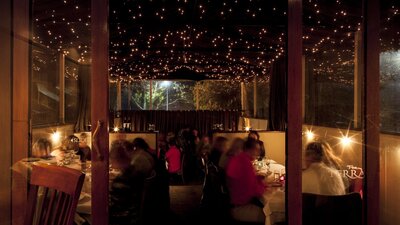 Romantic evening lighting over diners