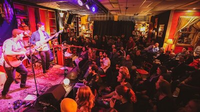 Band onstage at Smith's Alternative in front of an audience