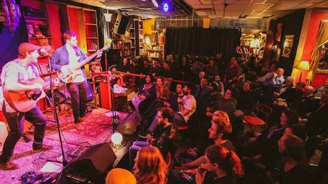 Band onstage at Smith's Alternative in front of an audience