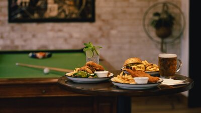 Enjoy a game of pool in the front bar with a cold beer and great food