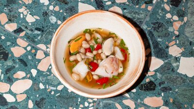 blue eye in broth with sun dried tomatoes and beans