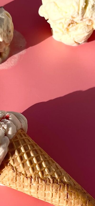 Handmade Strawberry Ice-Cream There’s ice-cream cones on a pink background