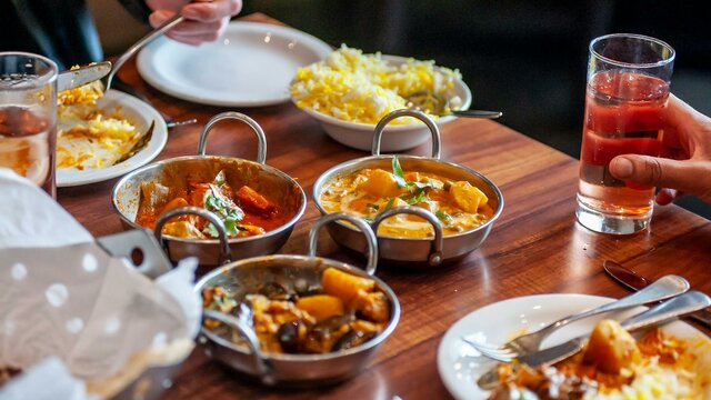 Dining Dining table with a variety of food dishes in front of diners
