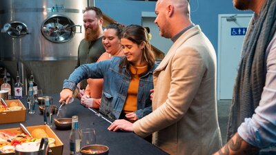 Guests do a tasting in the distillery