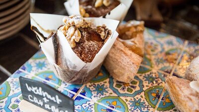 Sweet muffins and pastries on aztec tiles