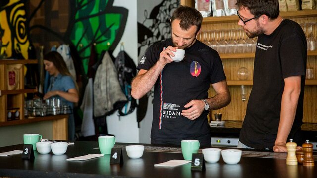 Discover the art of coffee at The Cupping Room Two coffee experts smelling the coffee beans