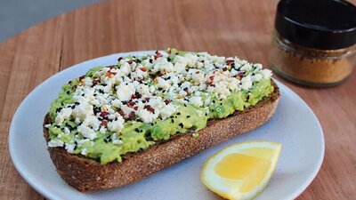 Avocado on toast with feta cheese and lemon